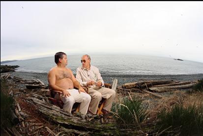 trailer park supervisors on beach with islet in background on right