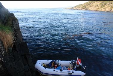 boat tied to rocks