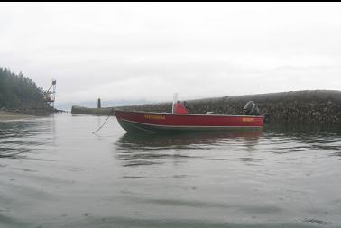 BOAT ANCHORED NEAR BARGE