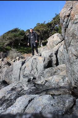 on rocks above boat