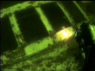 DIVER APPROACHING SKYLIGHTS TO BOILER ROOM