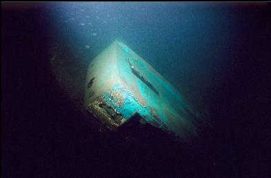 WRECKAGE AT BASE OF WALL