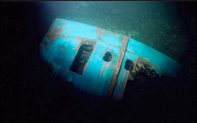 WRECKAGE AT BASE OF WALL