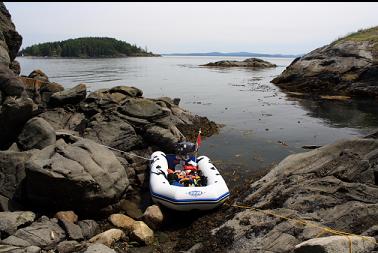 Tied up in small bay with exposed reef in backgond