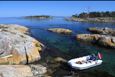 anchored by rocks with Strongtide Island in background on left