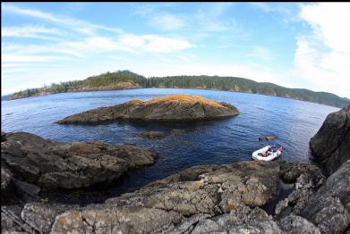 anchored behind islet with channel in background