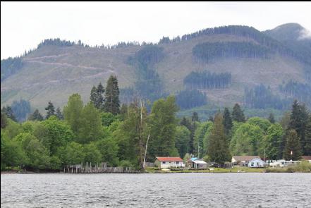 view of the rail dock pilings from across the bay