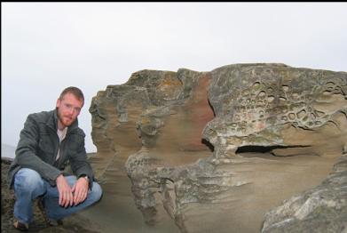 NEXT TO SANDSTONE ON BEACH