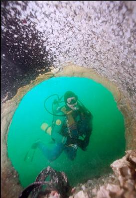 LOOKING OUT OF SEWER PIPE