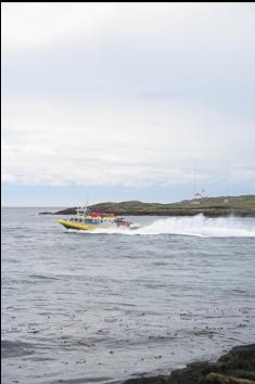 WHALE-WATCHING BOAT IN CHANNEL