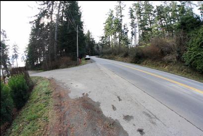 parking on West Coast Road and access lane on left