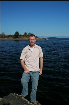 STANDING ON END OF RUBBLE BREAKWATER