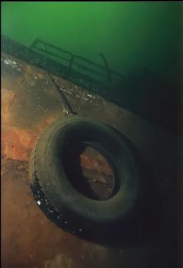 TIRE ON SIDE OF HULL